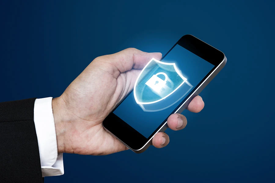 Businessman using mobile smart phone with lock icon on screen