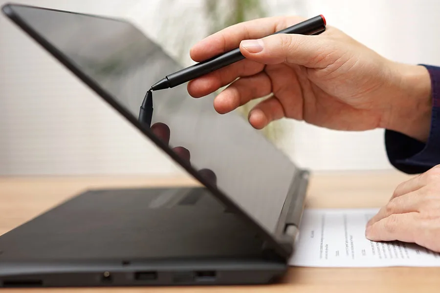 Student Using a Touchscreen Laptop Computer