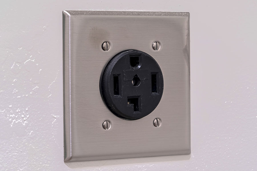AC electrical plug outlet for a dryer