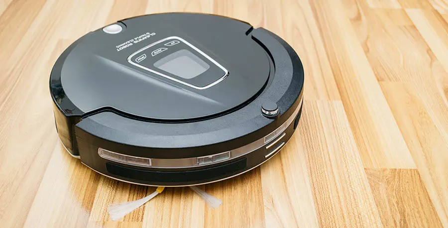 Robot vacuum cleaner on laminate wood floor, Home Smart robotic