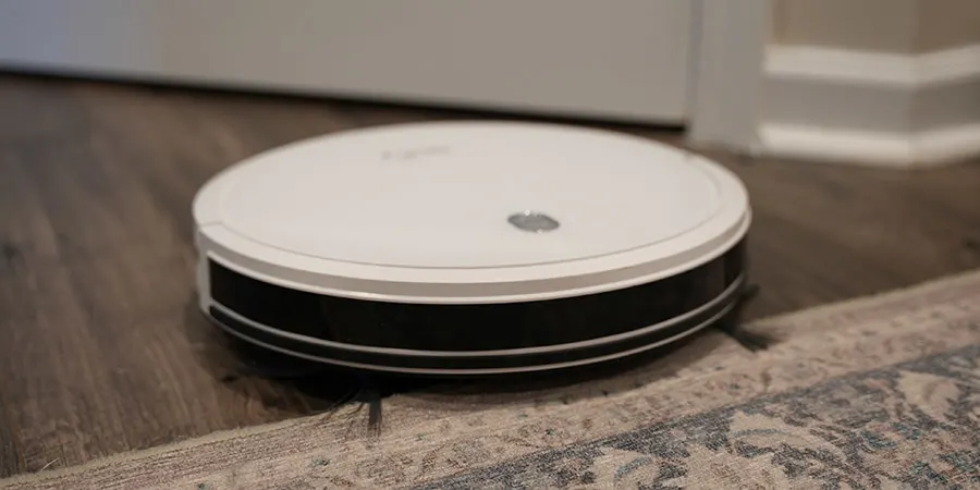 Robot Vacuum Going Over Kitchen Rug