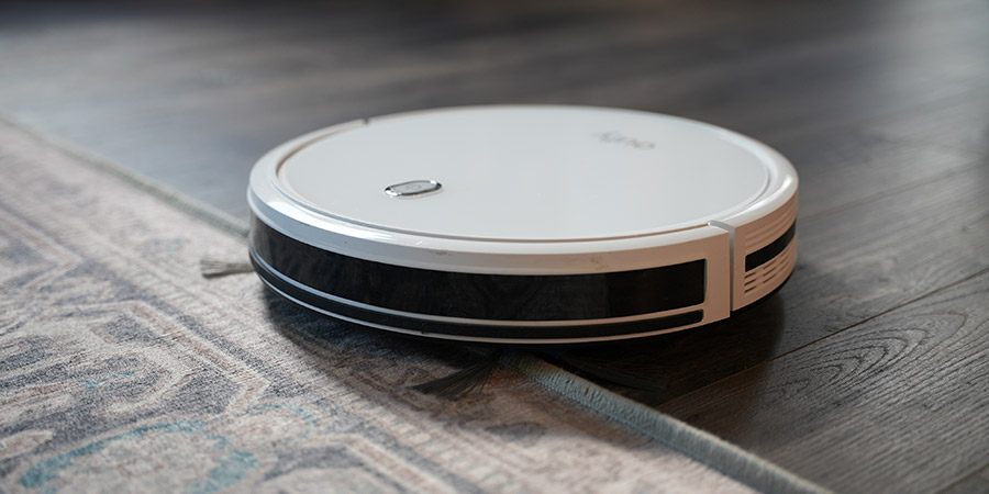 Robot Vacuum Going Over Living Room Rug