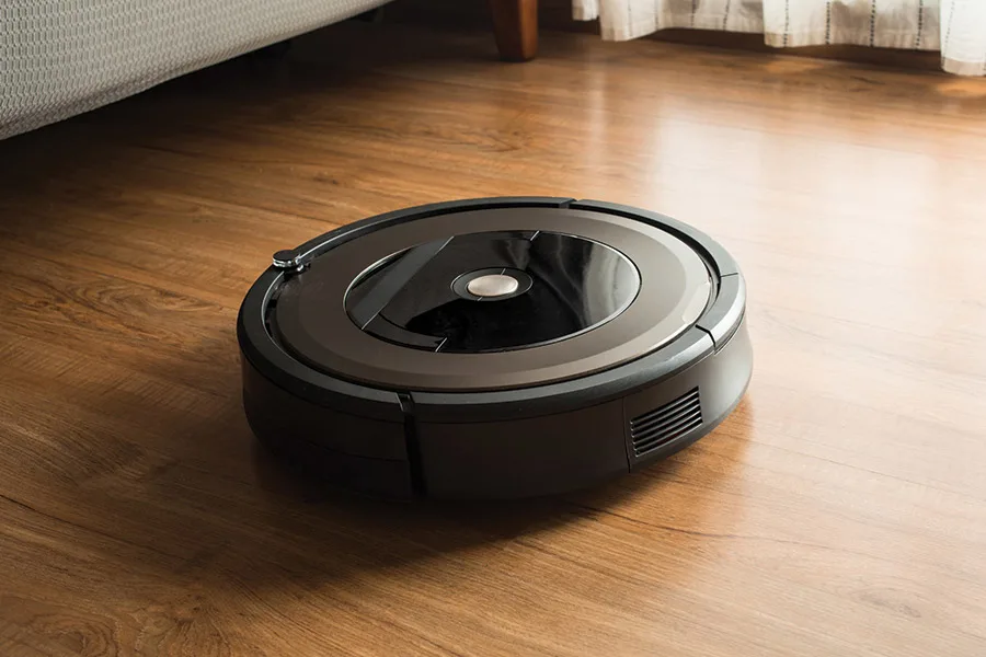 Robot vacuum cleaner on wooden laminate floor