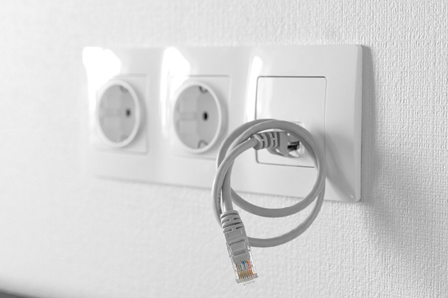 Ethernet jack next to power outlets for a tv