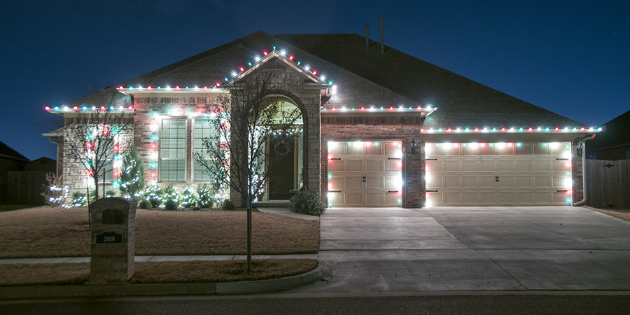 Christmas lights outside on a home at night