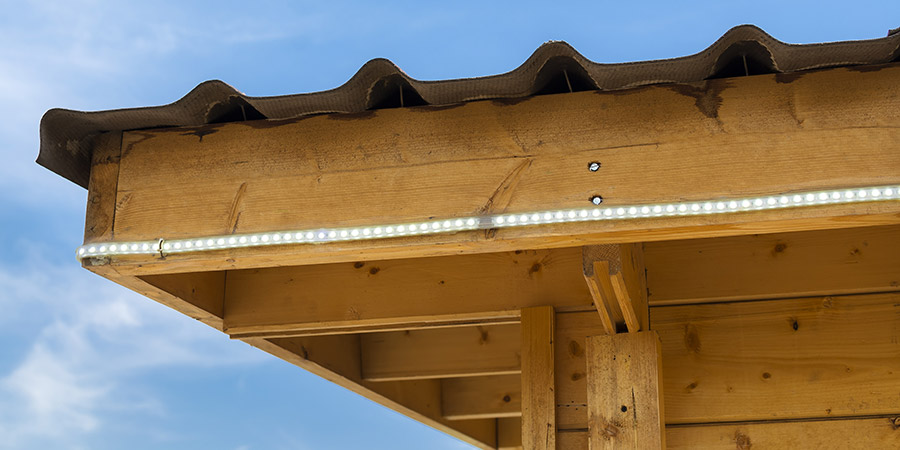 Led strip light on wooden kiosk wall