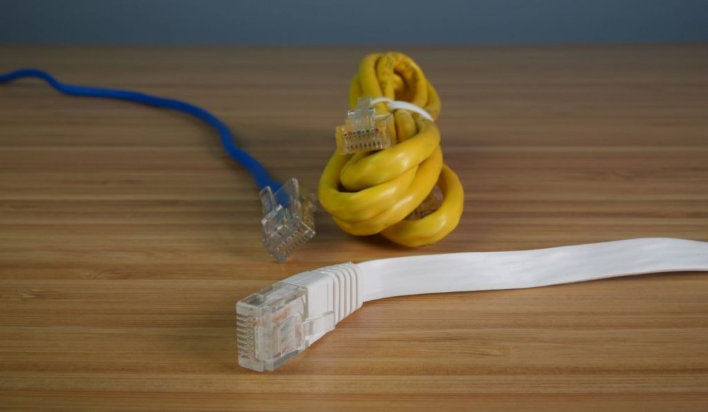 Flat White, Round Blue, and Round Yellow Ethernet Cable