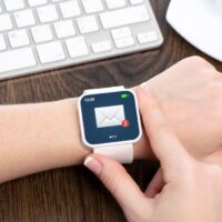 Female hand with smartwatch with email