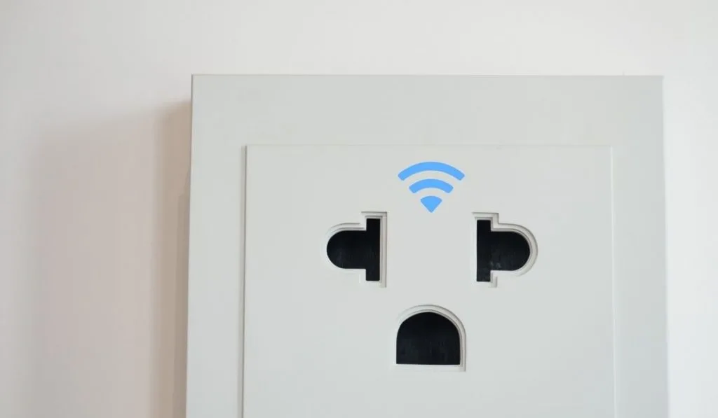 White Wifi Smart Outlet on the wall