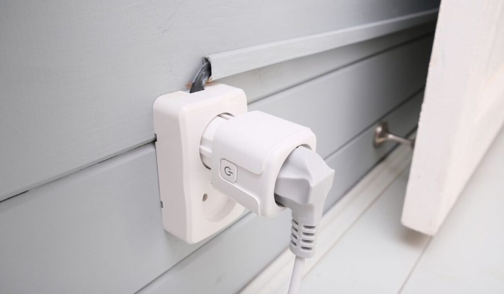Wi-fi smart socket on the wall in a smart home