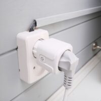 Wi-fi smart socket on the wall in a smart home