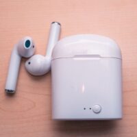 airpods with the case are on the desk