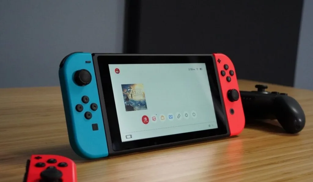 Nintendo Switch on a wooden desk - 1