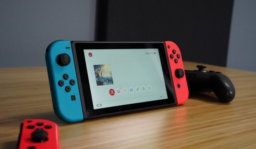 Nintendo Switch on a wooden desk - 1