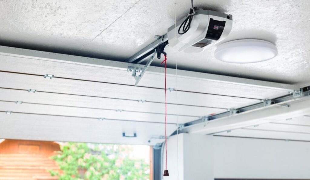 Opening door and automatic garage door opener electric engine gear mounted on ceiling with emergency cord