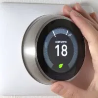 Smart Thermostat with a hand saving energy