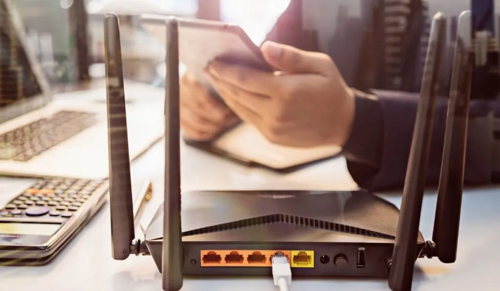 With business man using a computer in home office background