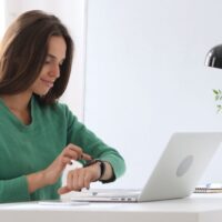 Creative Woman Using Smartwatch
