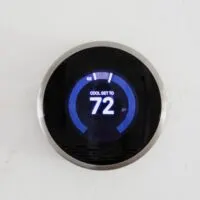 Digital modern thermostat at home