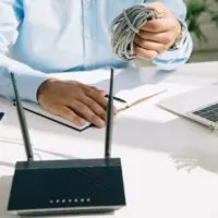 Partial view of businessman holding wire