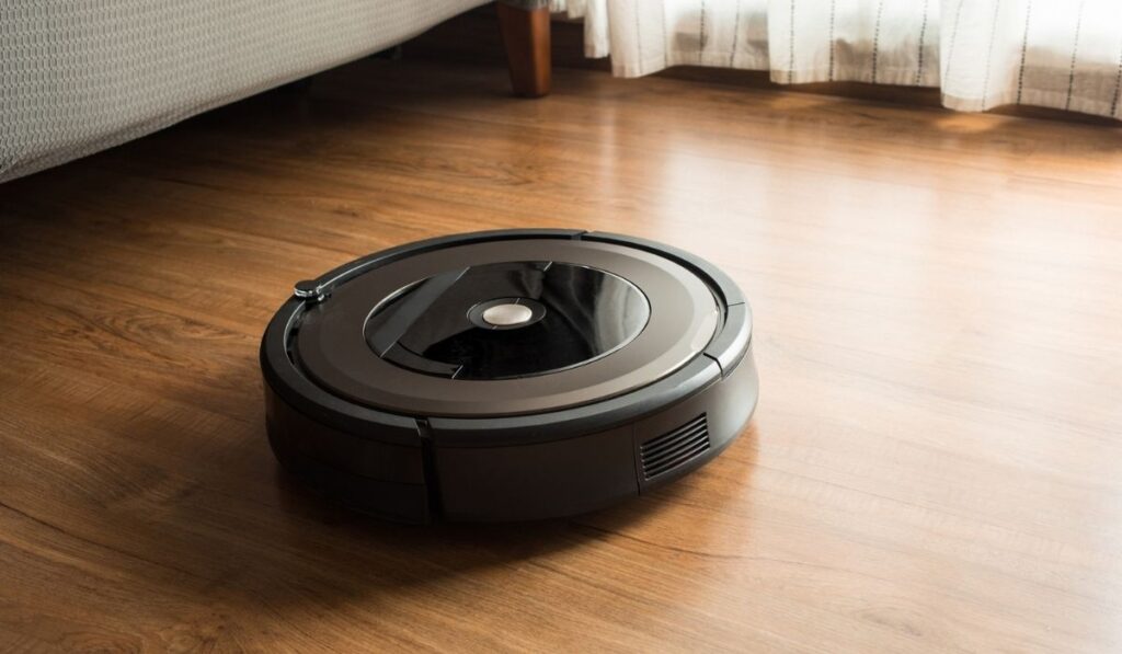 Robot vacuum cleaner on wood, laminate floor 