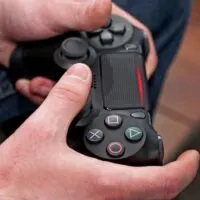 Man playing focus on game controller