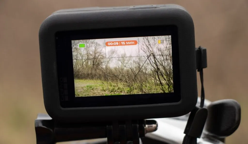 A GoPro HERO 9 Black on a bicycle in the forest in spring