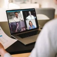 Businesswoman having online business meeting from home