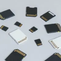 MicroSD memory card and hand on the background of other SD memory cards