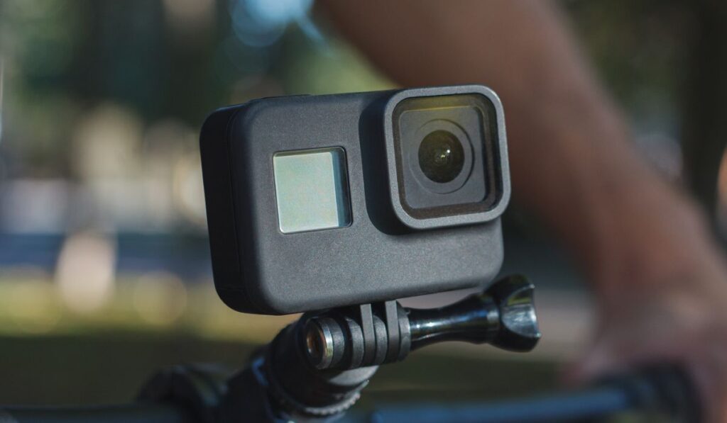 Action camera mounted on the handlebar of a bicycle 