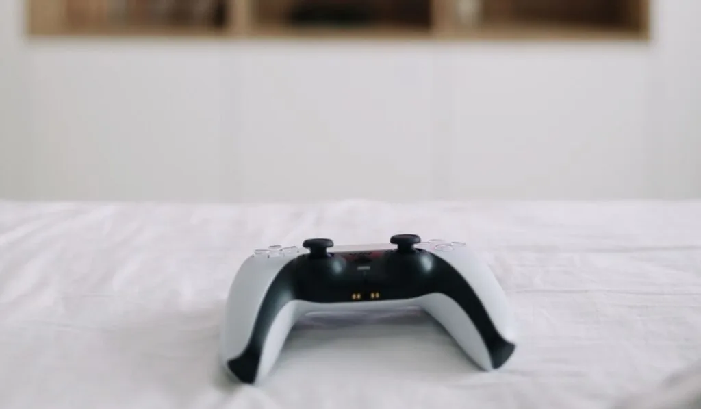 Game controller, joystick on TV screen background 