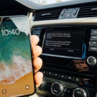 Man Connecting to Apple cArPlay the new iphone X 10 by Apple