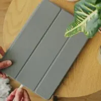 Plugging the charging cable in the port of a tablet device to charge the battery