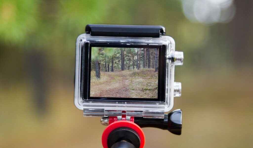 Taking video with action camera on handheld stick