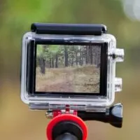 Taking video with action camera on handheld stick