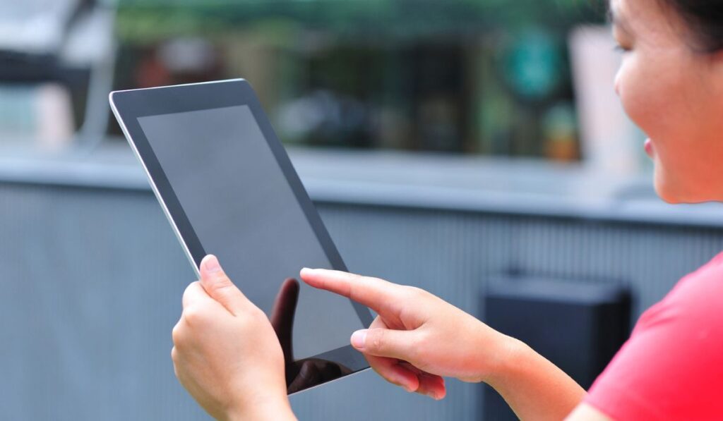 Woman use new black tablet computer