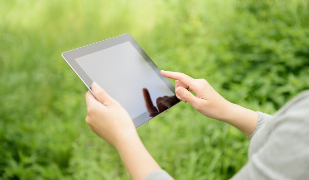 Woman using Apple Ipad digital tablet