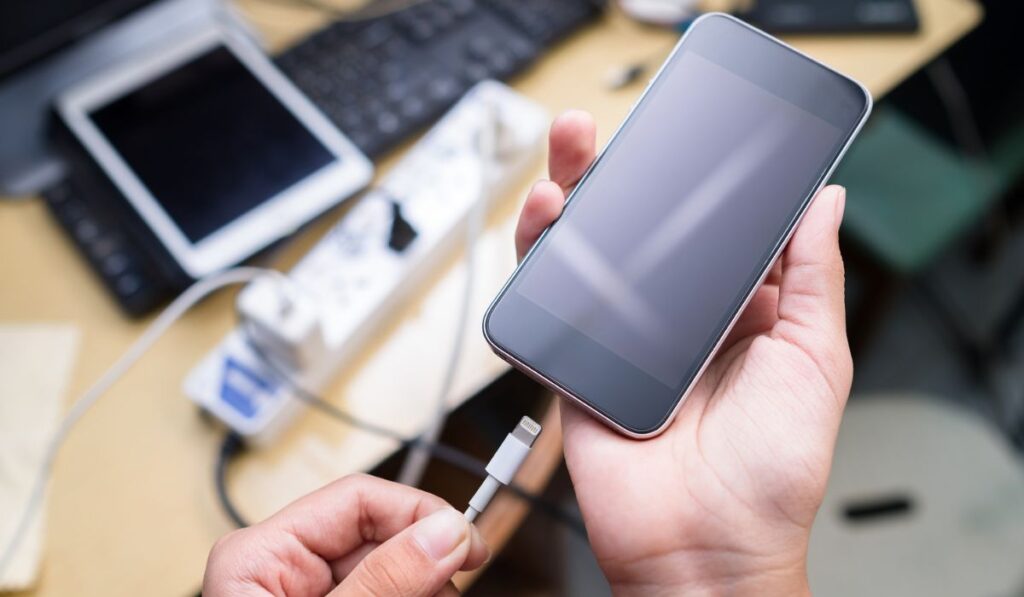 Charging Phone Battery on Busy Desk