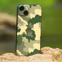 Close-Up Shot of a Mobile Phone on Brown Rock