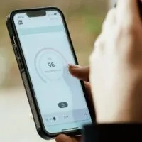 Iphone phone on womans hand