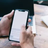 Millennial guy connecting to 4g internet for sending sms via cellular app