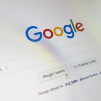 Google search service page is open on the computer screen in close-up