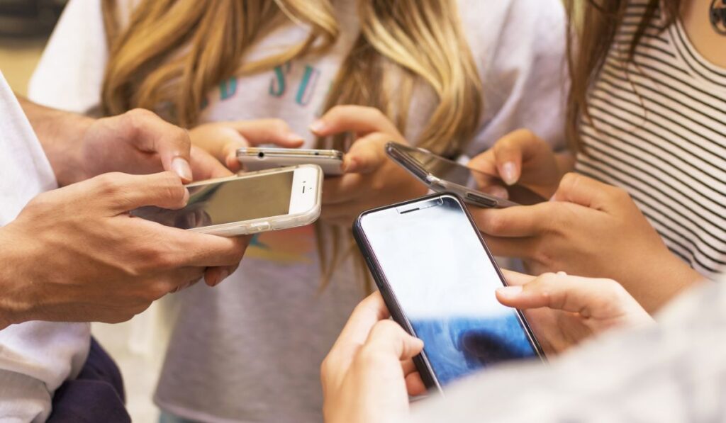 Group of young people with mobile phones