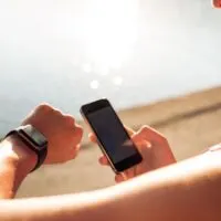 Sportswoman using smart devices