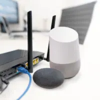 Google Home and Router on a table