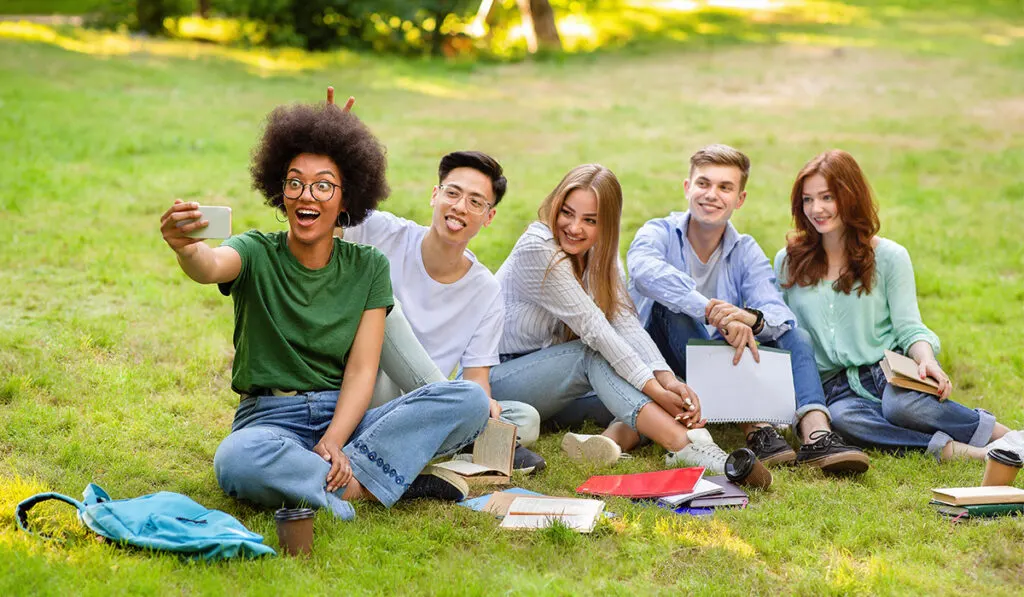 Group of friends taking a selfie at a park