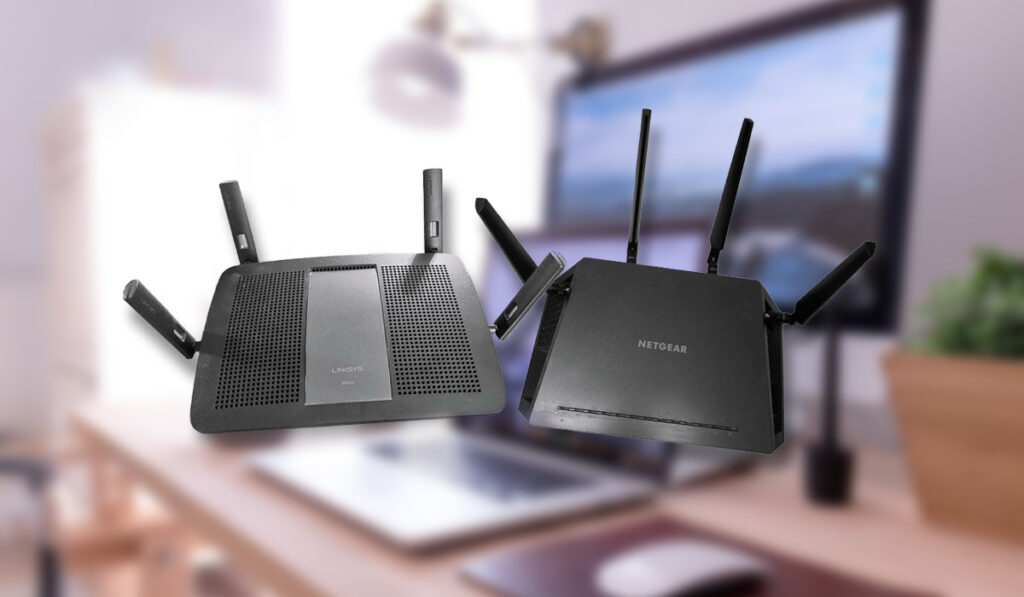 Linksys AC2400 and Netgear Nighthawk X4 AC2350 side by side over a blurred office 