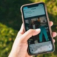 Photo of Person Using Mobile Phone