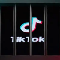 Tiktok logo behind bars