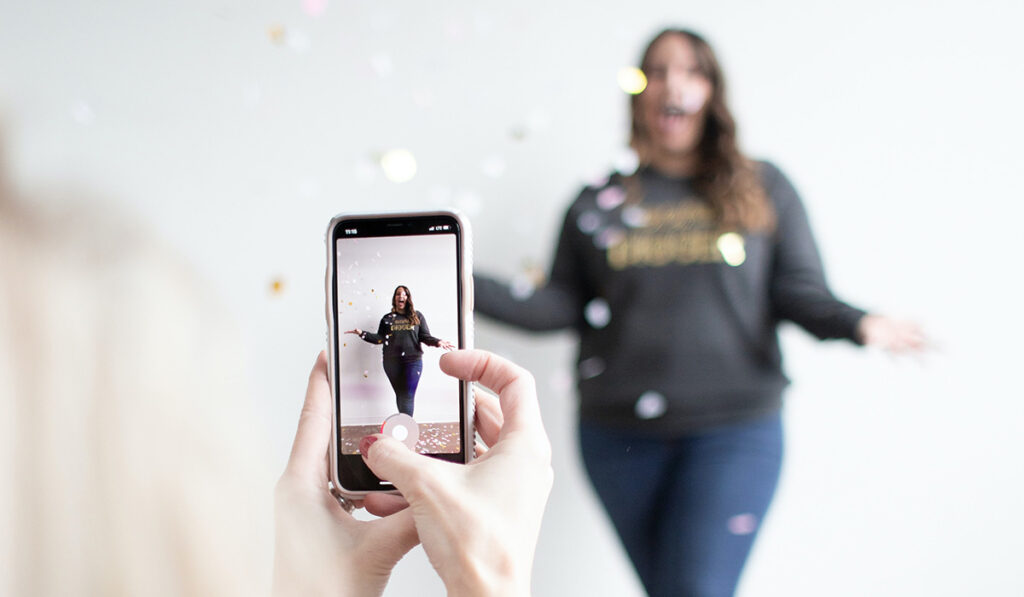 Woman taking a video using a phone